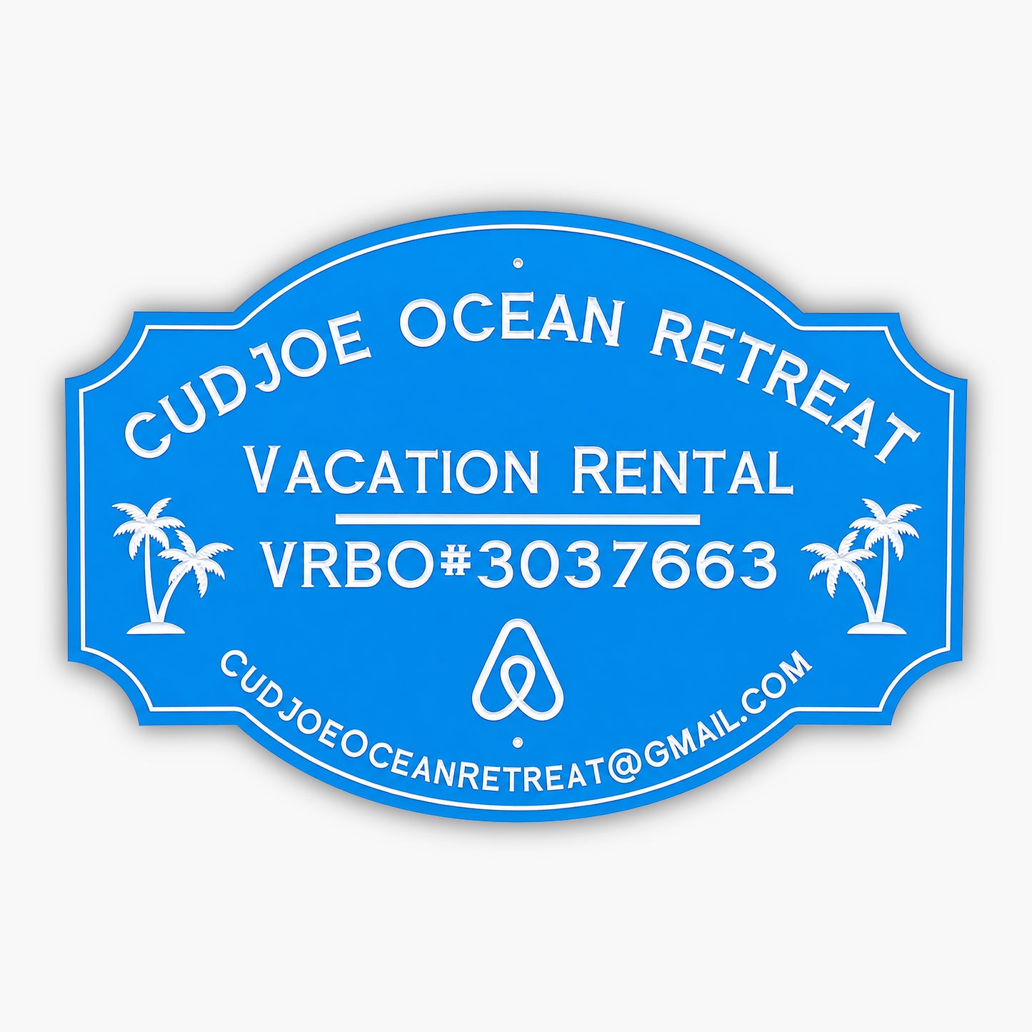 Custom PVC sign for Cudjoe Ocean Retreat, featuring a blue background with white engraved text and graphics. Includes vacation rental details, VRBO#3037663, email address, and palm tree illustrations, emphasizing weatherproof durability and elegance.
