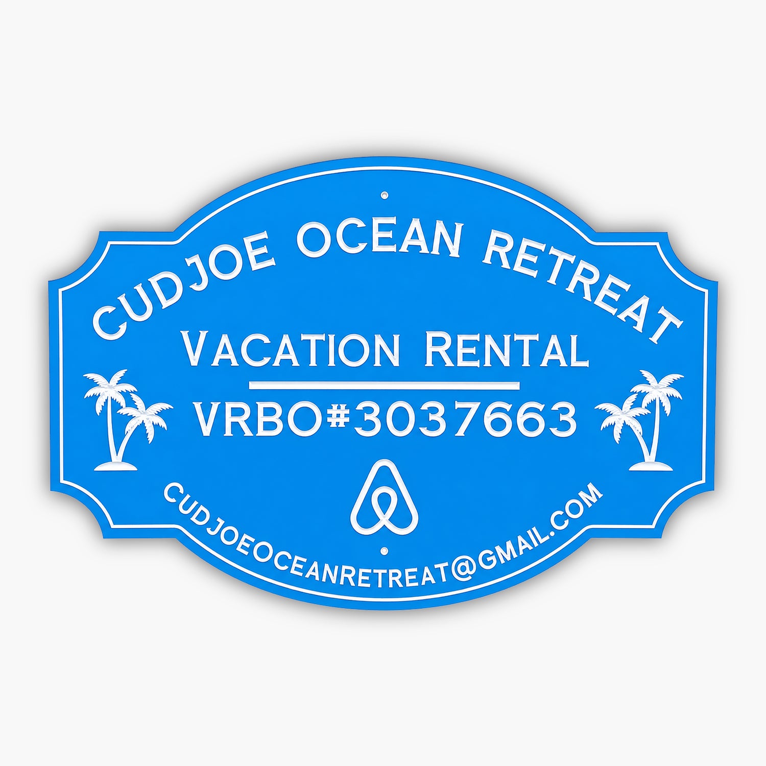 Custom PVC sign for Cudjoe Ocean Retreat, featuring a blue background with white engraved text and graphics. Includes vacation rental details, VRBO#3037663, email address, and palm tree illustrations, emphasizing weatherproof durability and elegance.