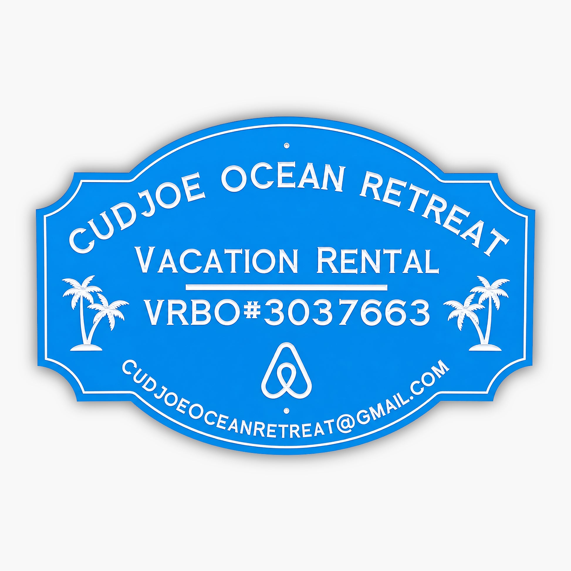 Custom PVC sign for Cudjoe Ocean Retreat, featuring a blue background with white engraved text and graphics. Includes vacation rental details, VRBO#3037663, email address, and palm tree illustrations, emphasizing weatherproof durability and elegance.