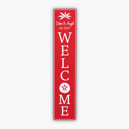 welcome sign with sand dollar red