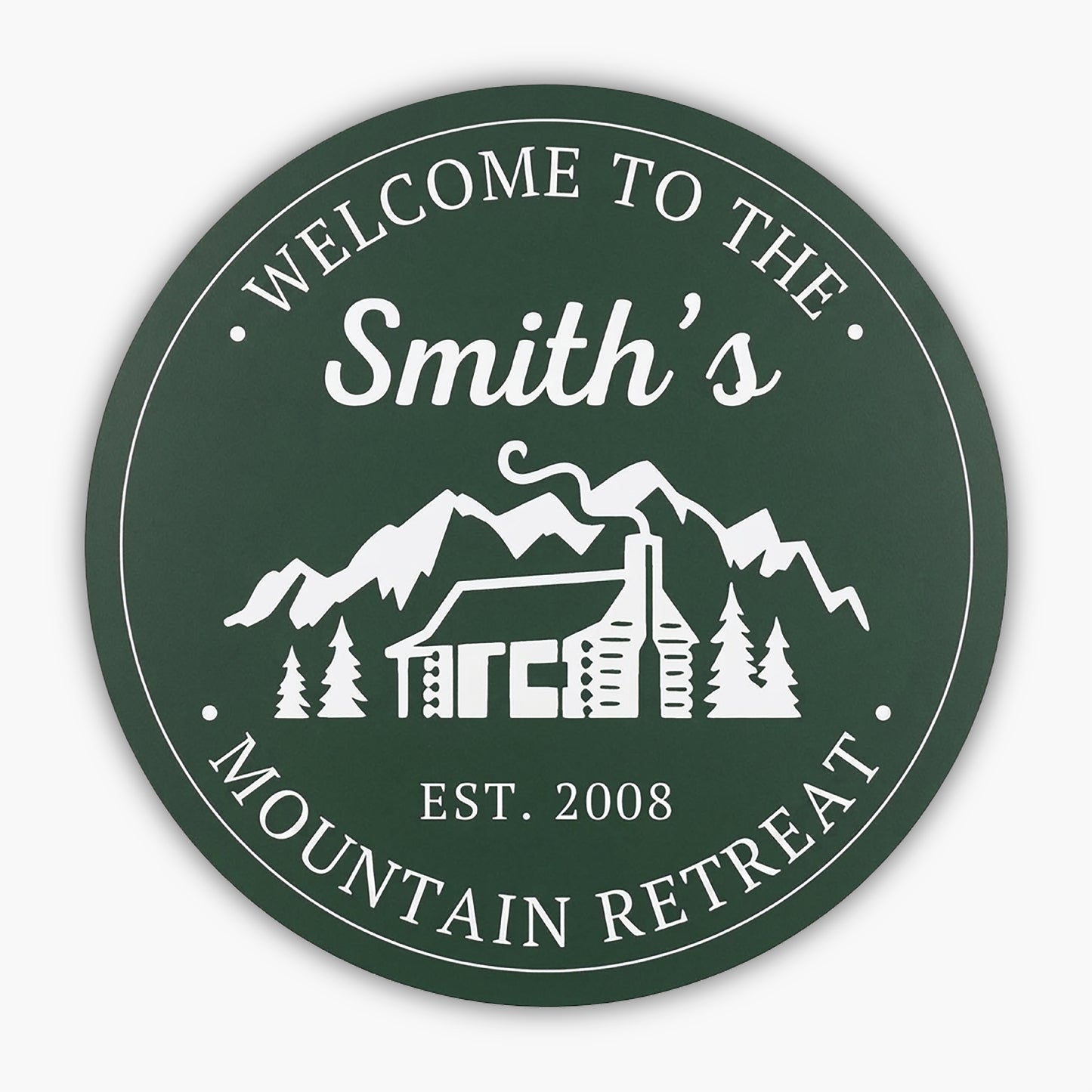 The Custom Carved Round PVC Cabin Sign welcomes guests with Welcome to the Smiths Mountain Retreat and Est. 2008, featuring a white illustration of a cabin, trees, and mountains, capturing the serene essence of this retreat beautifully.