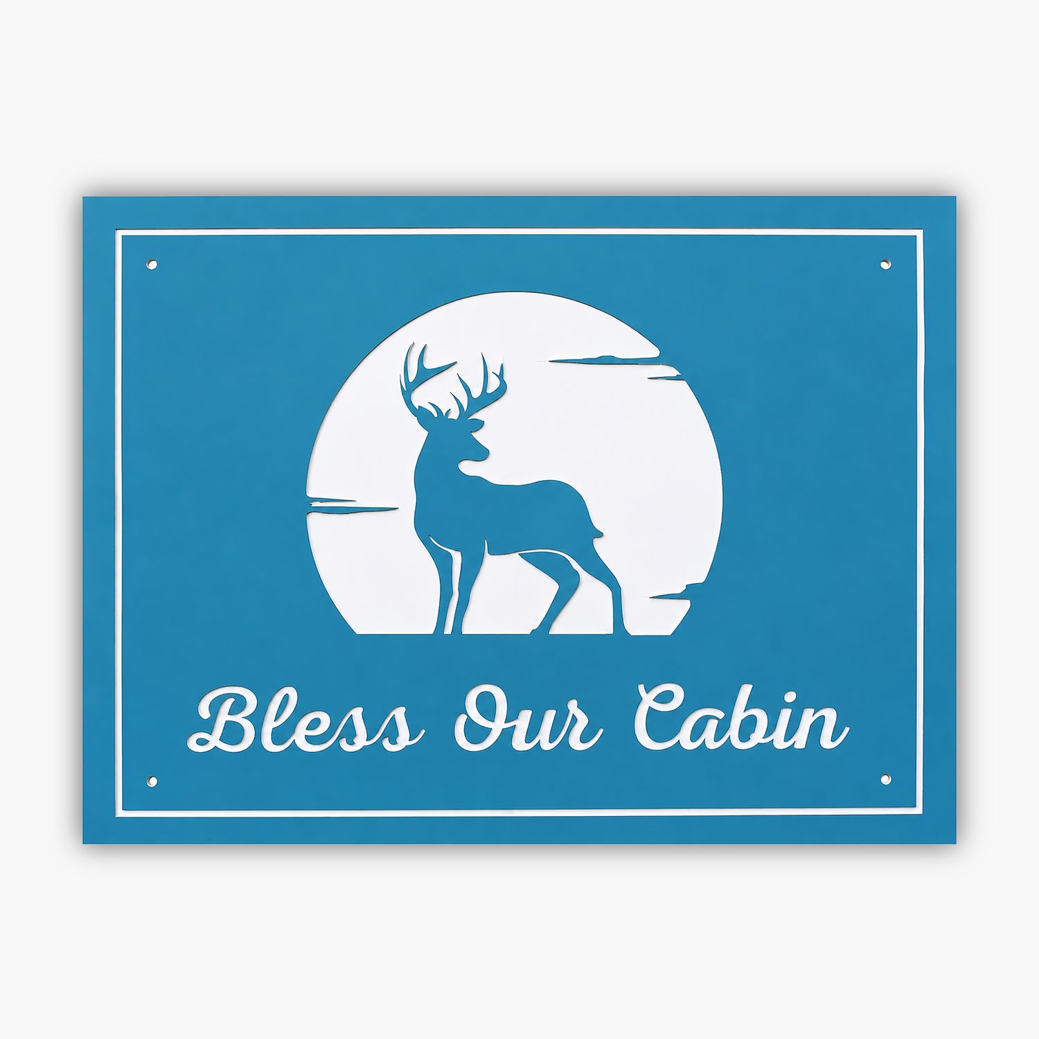 A charming PVC sign features a silhouette of a deer on a serene blue backdrop, encircled by a glowing white moon. Below, the words Bless Our Cabin gracefully appear in elegant white cursive, adding rustic charm to your cabin decor.