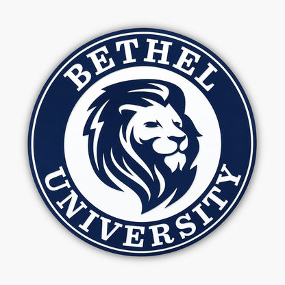 The logo of Bethel University, akin to Personalized Oval Custom Beach House Signs Coastal Decor, displays a stylized lions head in profile within a circular border. Bethel University is boldly etched around the edge in capital letters, with blue and white as the primary design palette.