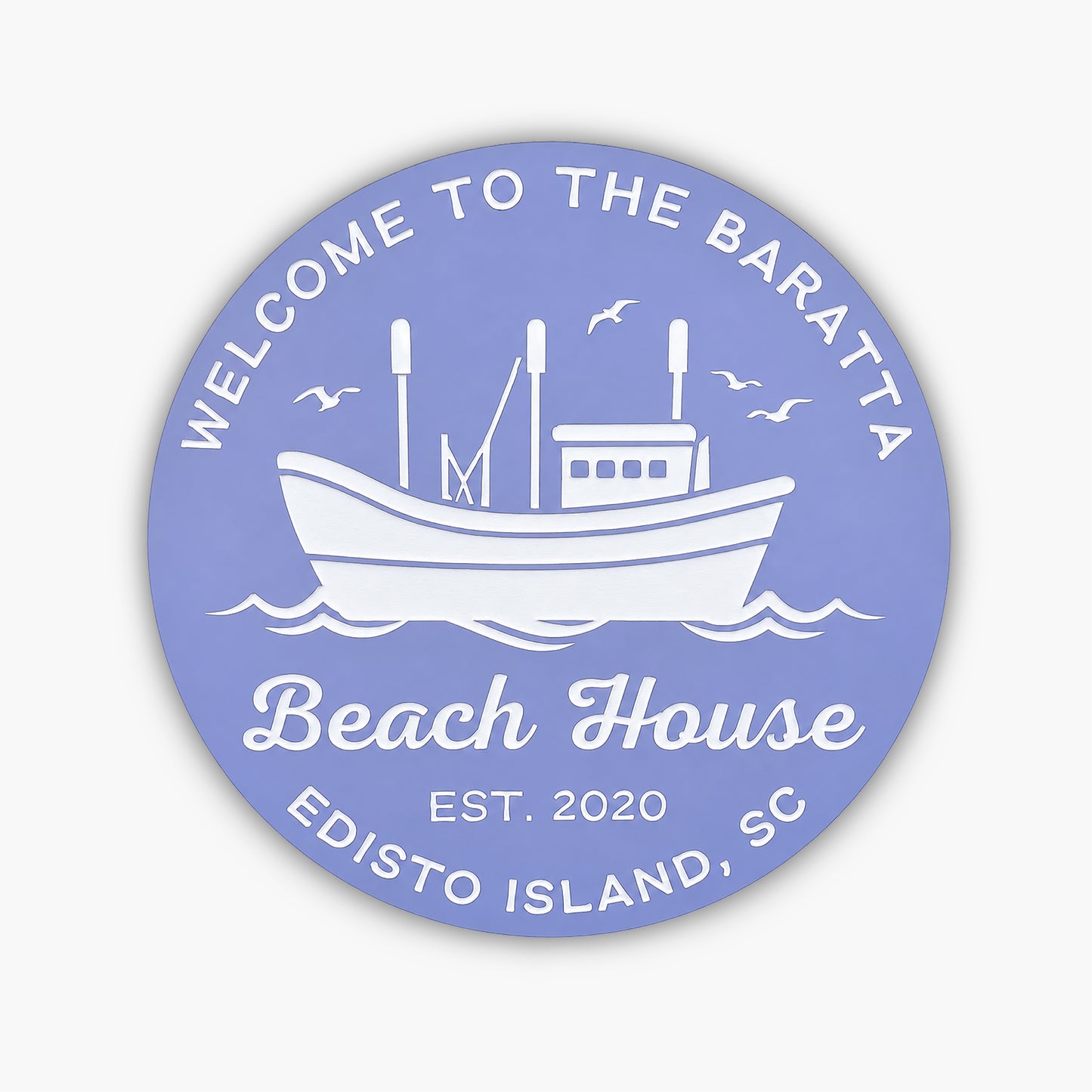 The Personalized Custom Round Beach House Sign Coastal Decor features a circular blue design with white text, reading: Welcome to the Baratta Beach House, Est. 2020, Edisto Island, SC, with a boat illustration and birds soaring above waves.