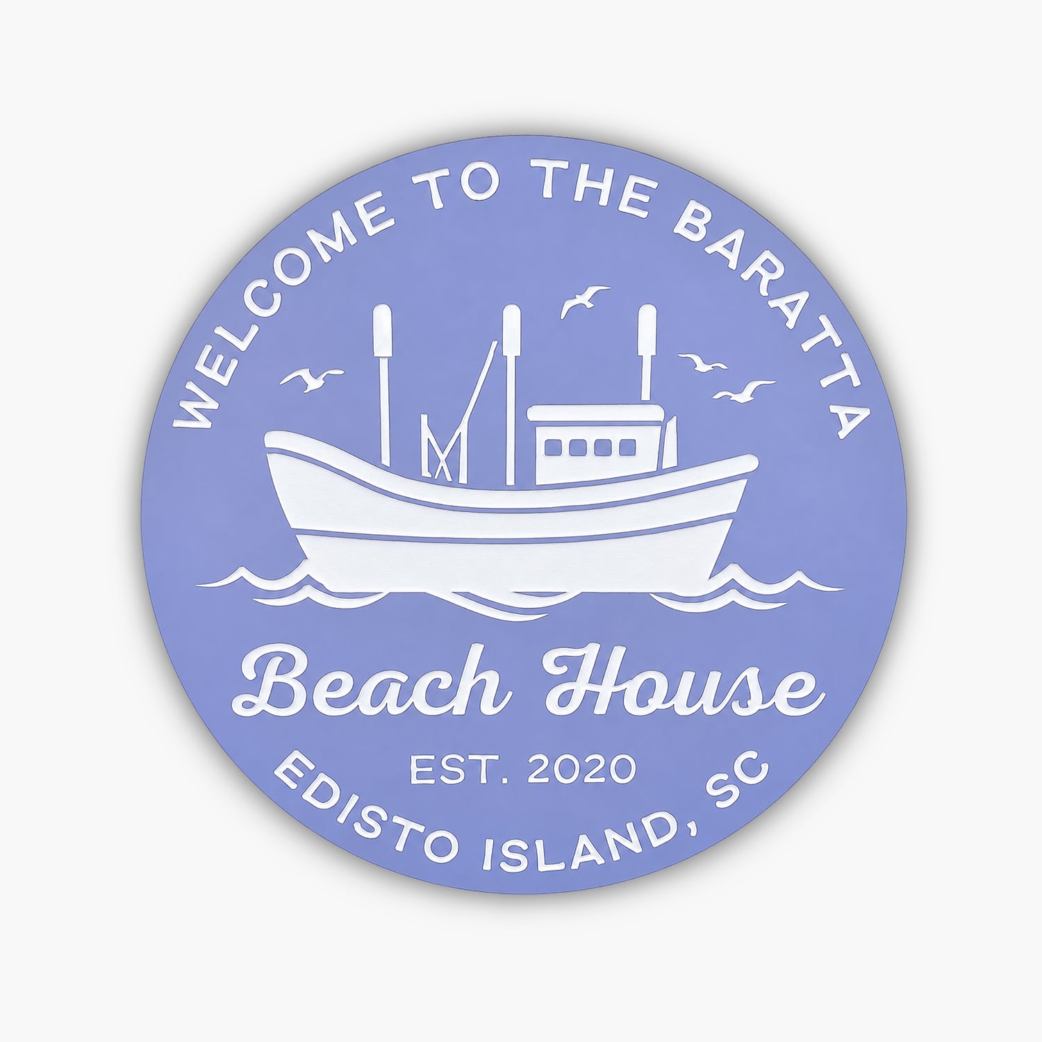 The Personalized Custom Round Beach House Sign Coastal Decor features a circular blue design with white text, reading: Welcome to the Baratta Beach House, Est. 2020, Edisto Island, SC, with a boat illustration and birds soaring above waves.