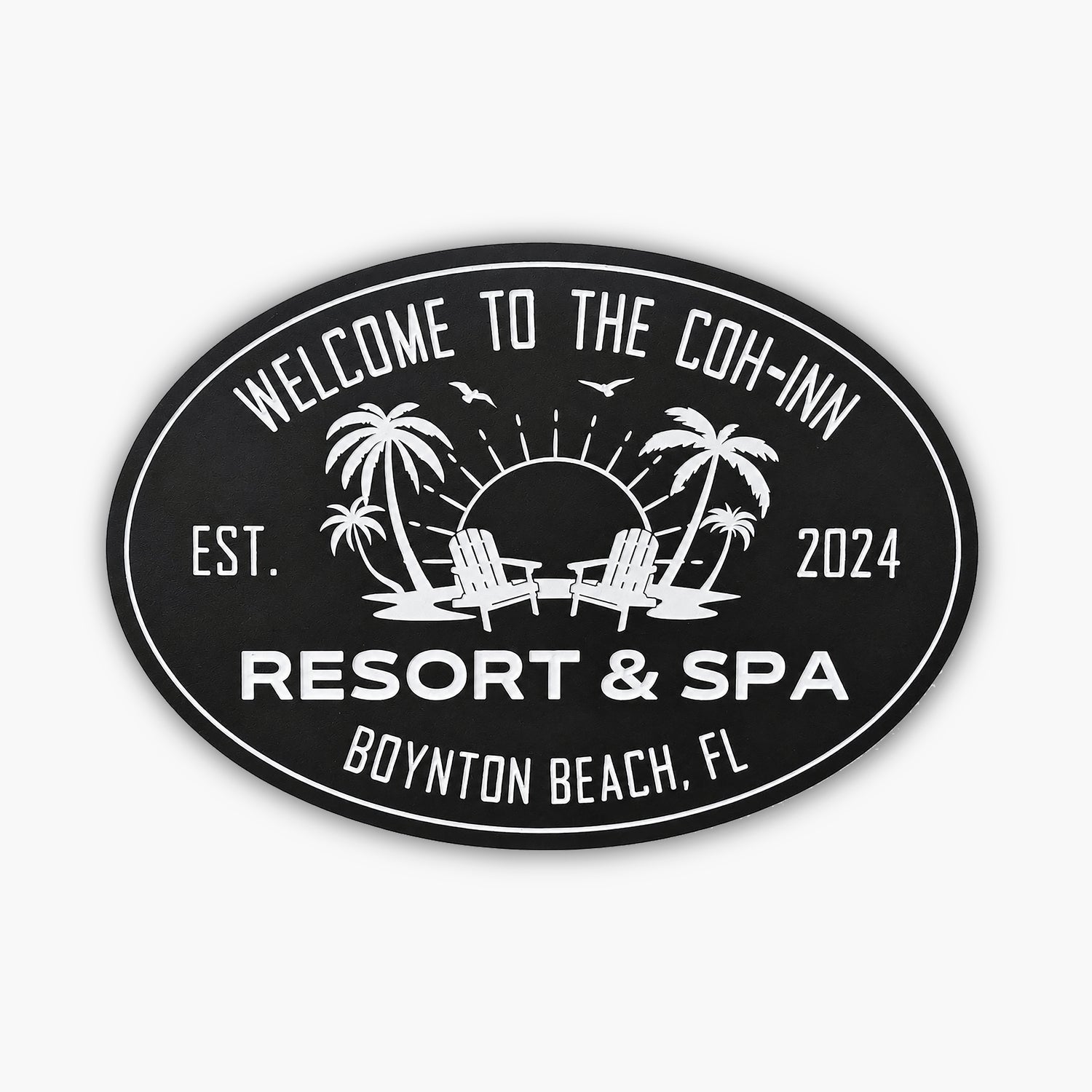 Oval sign reading Welcome to the Coh-Inn, Resort & Spa, Boynton Beach, FL, with established date 2024. The scene resembles an art gallery with a sunset backdrop featuring palm trees, birds, and two chairs against a wooden wall.