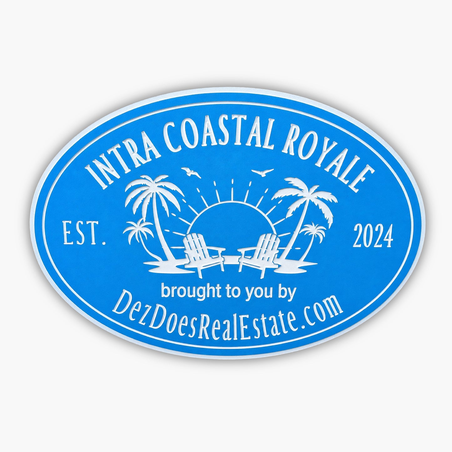 The Personalized Oval Custom Beach House Signs Coastal Decor features a blue oval logo with palm trees, Adirondack chairs, a sun, and birds. The text reads Intra Coastal Royale, Est. 2024, from DezDoesRealEstate.com, embodying the essence of beach house signs.