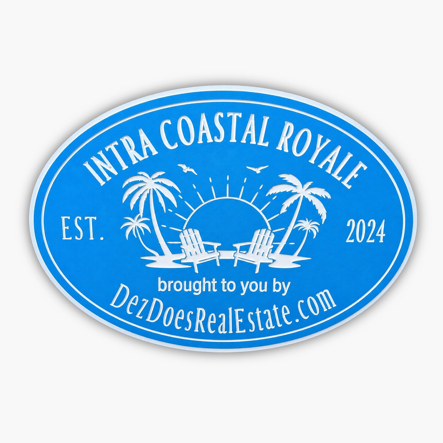 The Personalized Oval Custom Beach House Signs Coastal Decor features a blue oval logo with palm trees, Adirondack chairs, a sun, and birds. The text reads Intra Coastal Royale, Est. 2024, from DezDoesRealEstate.com, embodying the essence of beach house signs.