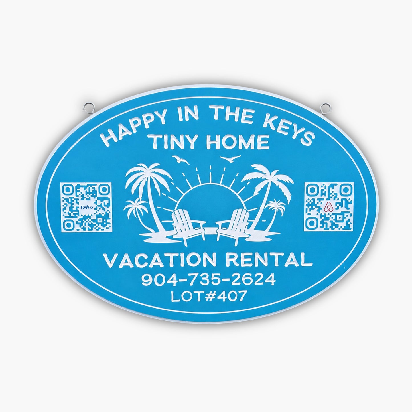 Blue oval sign from Personalized Sign for Vacation Rental, Airbnb, VRBO; features white text: Happy in the Keys Tiny Home, Vacation Rental. Includes phone number, lot number, palm trees, chairs, sun, birds & two QR codes.