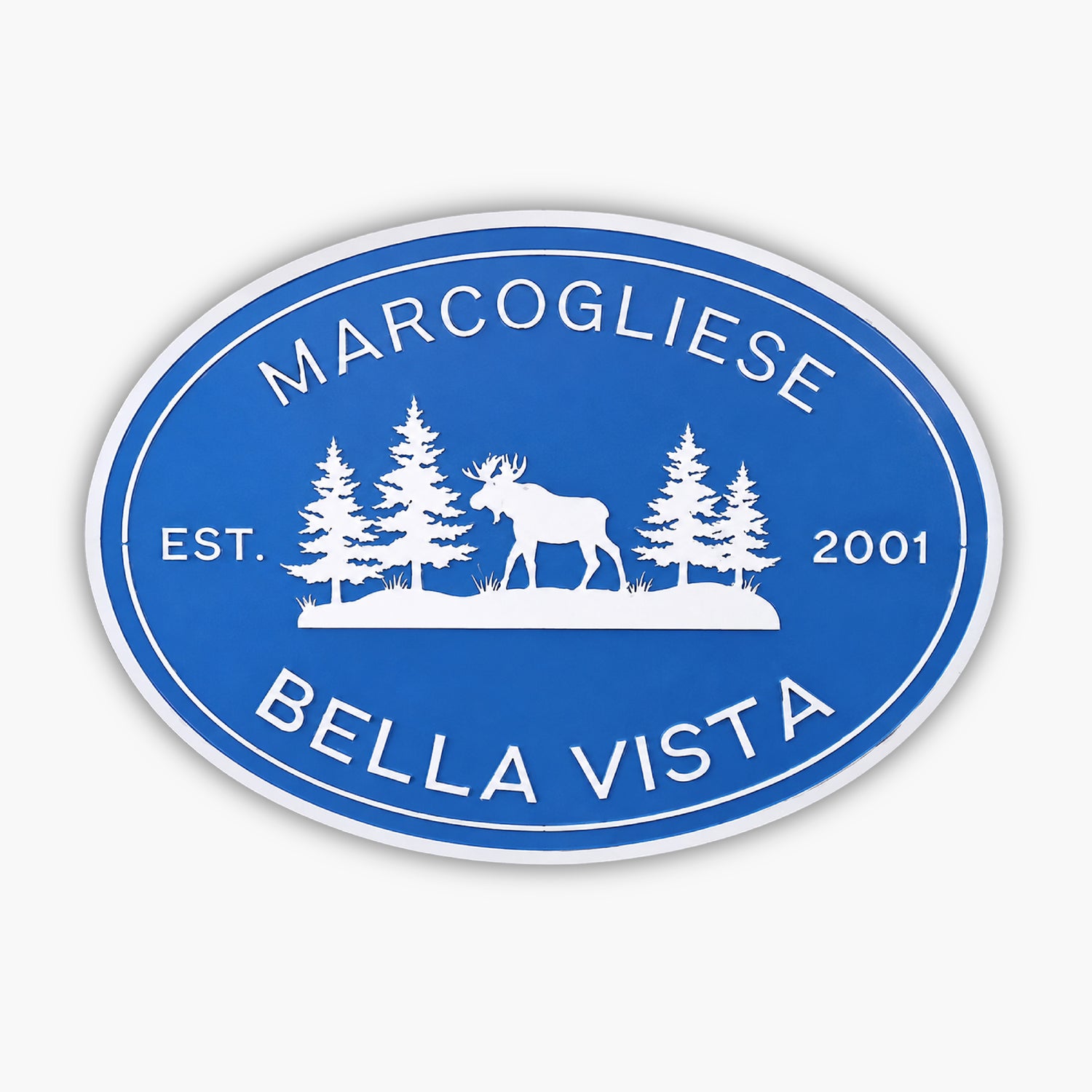 Oval blue PVC sign with a white border, featuring the text MARCOGLIESE at the top and BELLA VISTA at the bottom. In the center, a silhouette of a moose surrounded by trees. EST. 2001 is elegantly inscribed on either side.